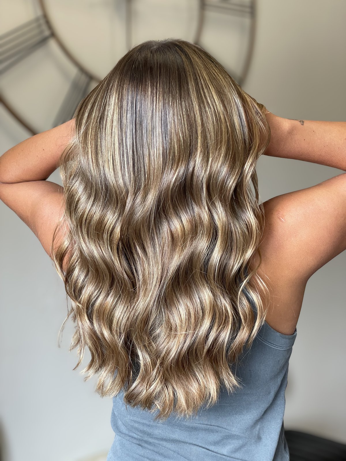 Lived-in bronde balayage with soft waves on long hair