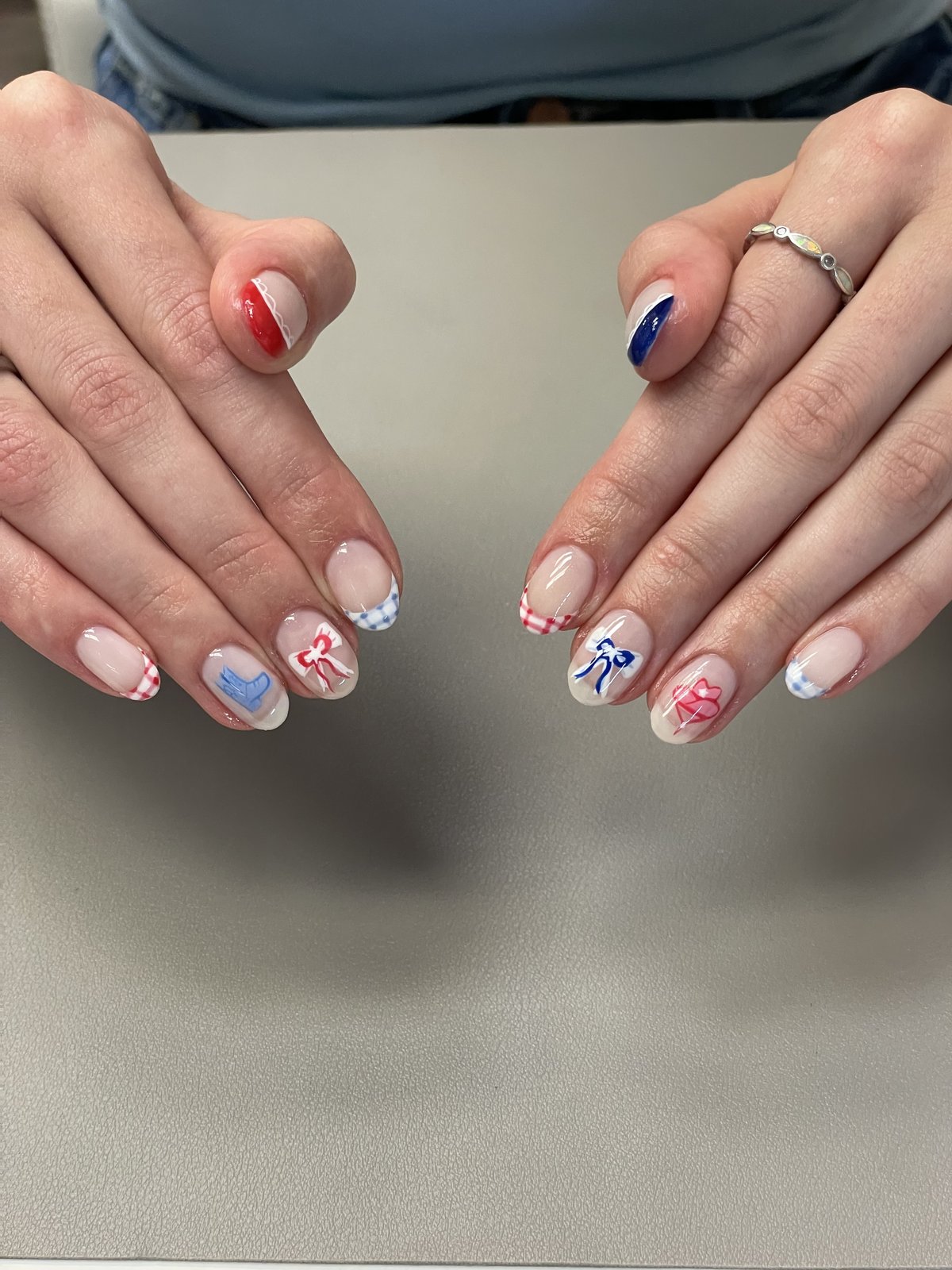 Red, white, and blue bow nail art with gingham French tips