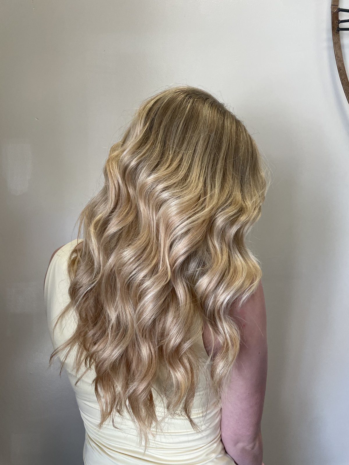 Buttery golden blonde with soft waves