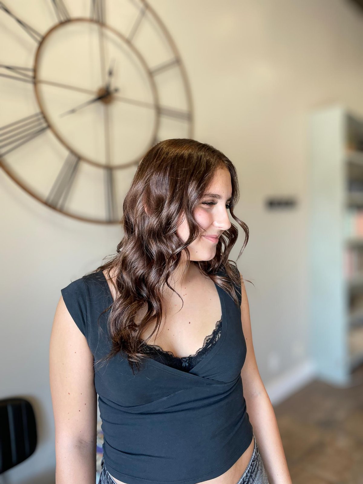 Brunette shoulder-length cut with soft curls — Logan, UT