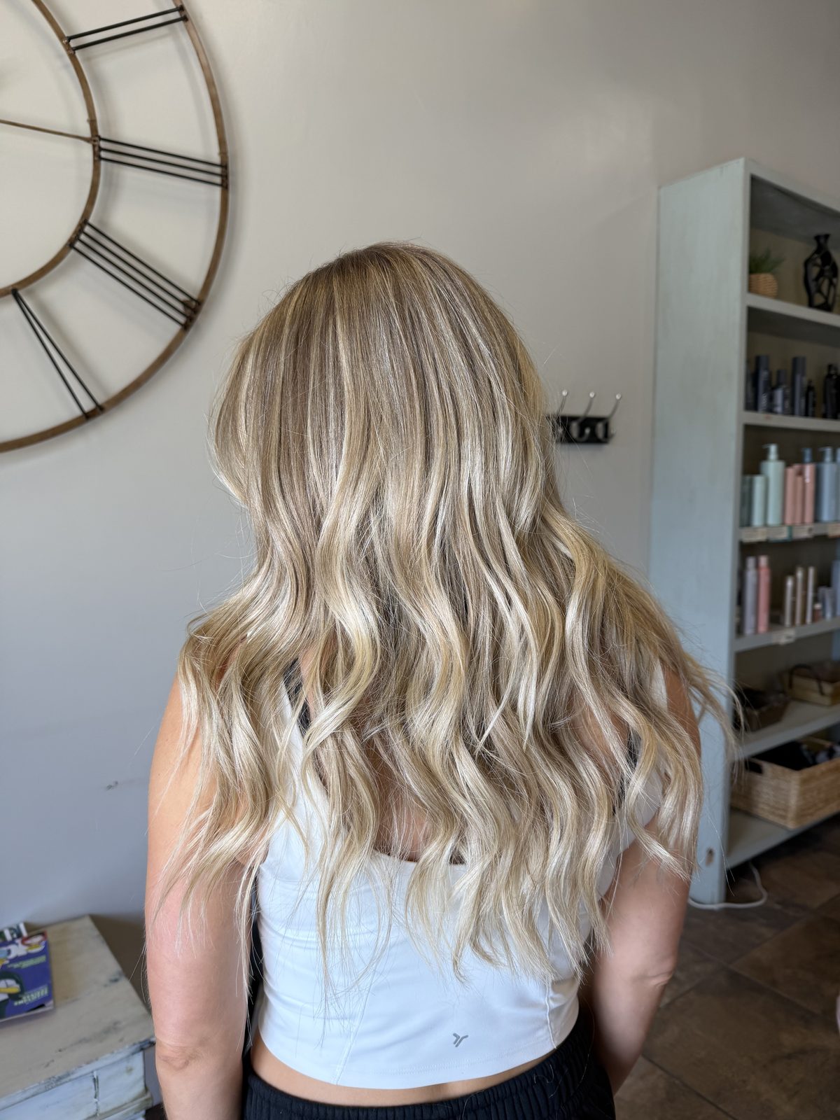 Dimensional blonde balayage with beachy waves, styled long — Logan, UT